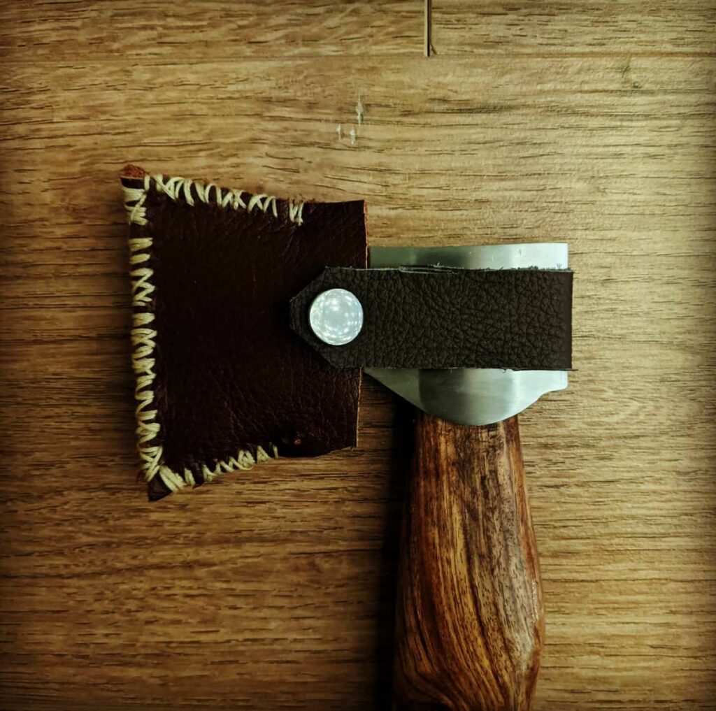 One of Chris' first leather projects was an axe sheath.