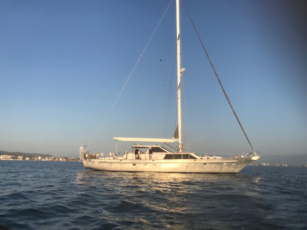 Collage of sailing boat stuff - winch, ropes, yacht in the sea